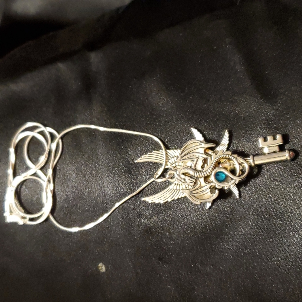 Necklace. Silver Dragon and Key with blue semi-precious stone, on silver chain.
